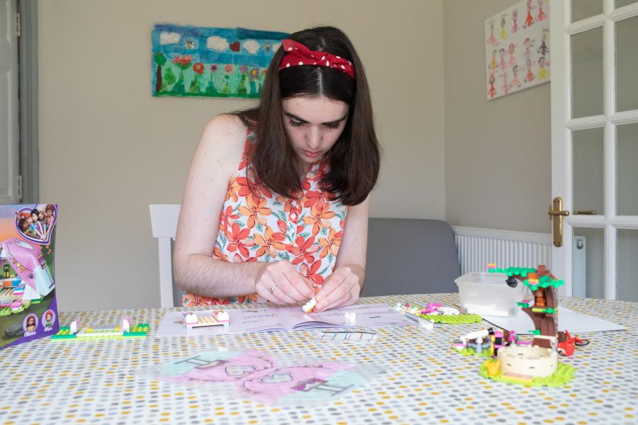 young girl with dravet syndrome building lego